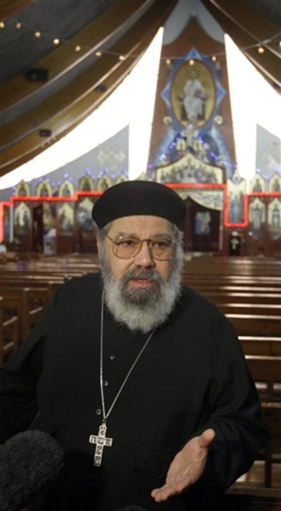 Father Girguis Lucas addresses reporters inside the Coptic church Sainte Marie Saint Marc of Chatenay-Malabry, south of Paris, Tuesday. Messages of threats against Coptic churches were seen on the Internet by a member of the congregation.
